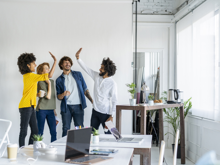 Colleagues giving each other high five