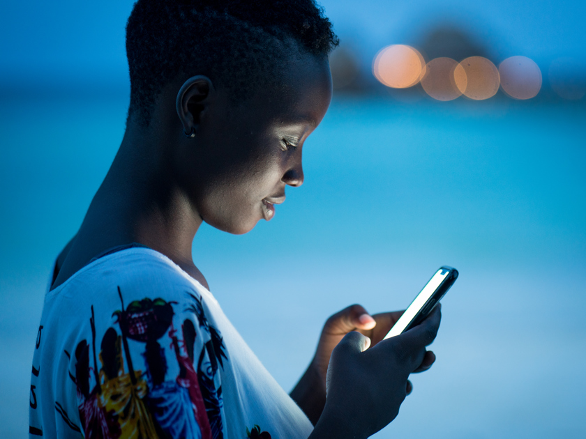 Woman on a phone at night